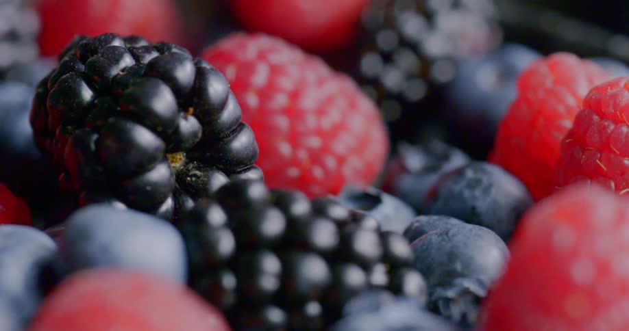 Blackberries blueberries and raspberries in a pile