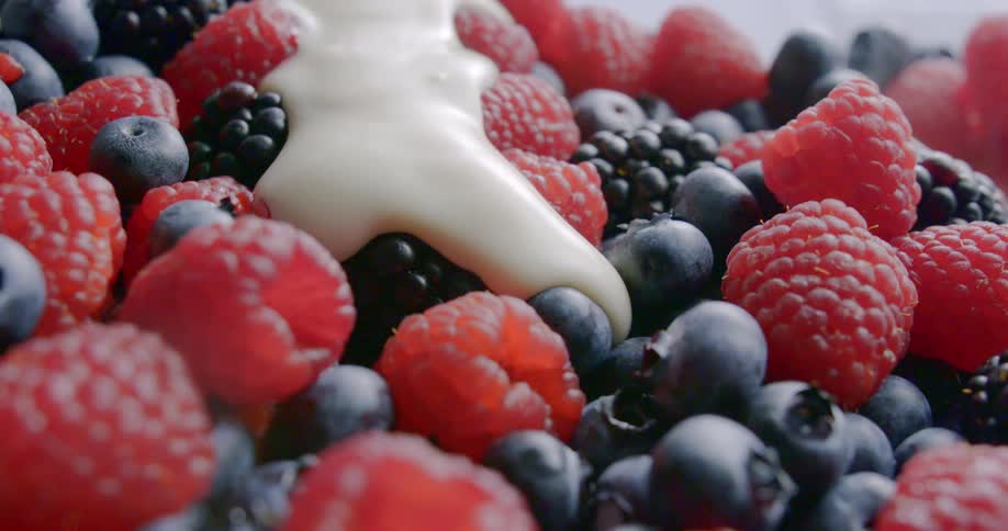 Cream runs across fresh berries