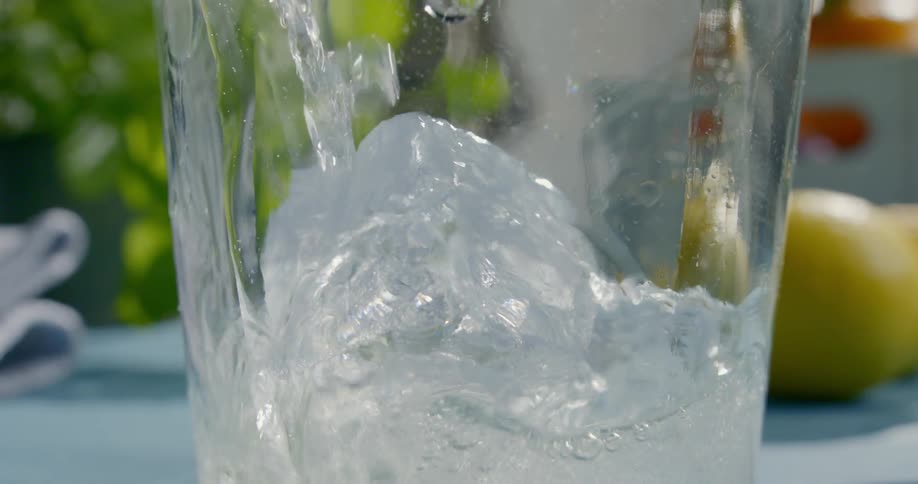 The pitcher is being filled with a drink