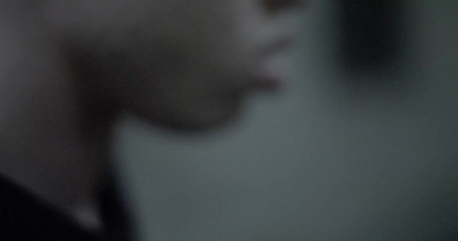 Two black teens face one another and argue