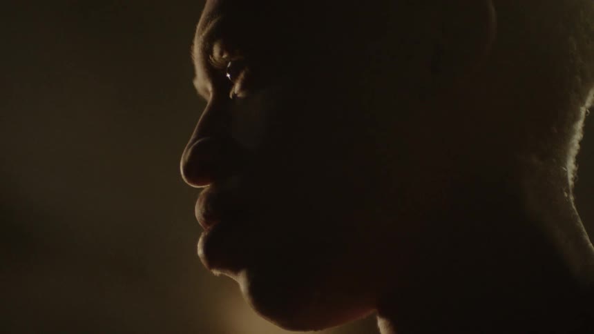 Close up of a man face on the shadows