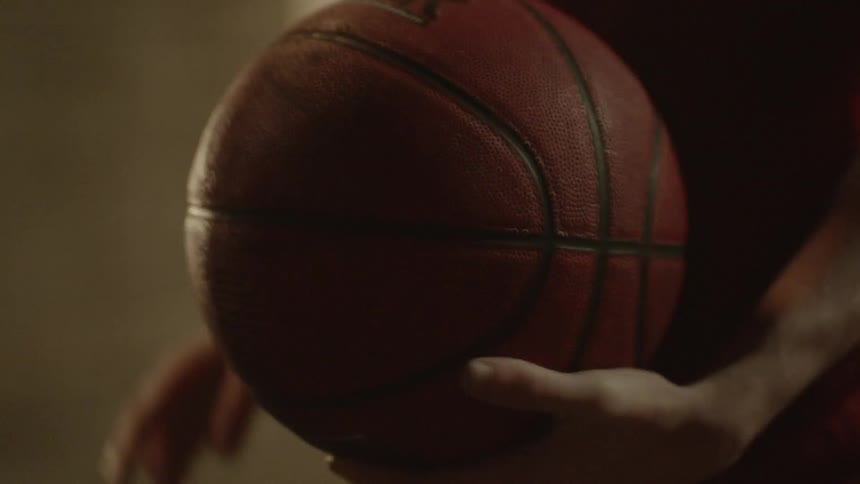 Man holding basketball and then throwing it