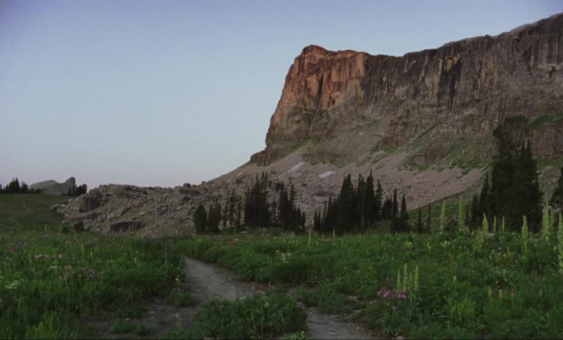 The trail leads to the mountain ahead