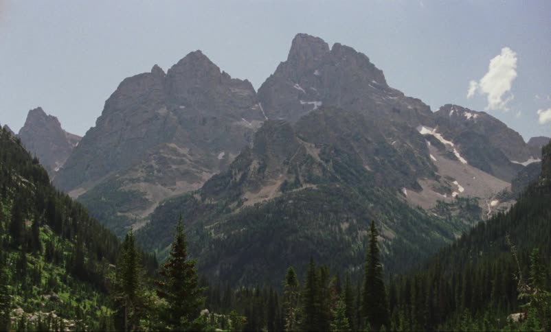 The hills lead to a mountain range