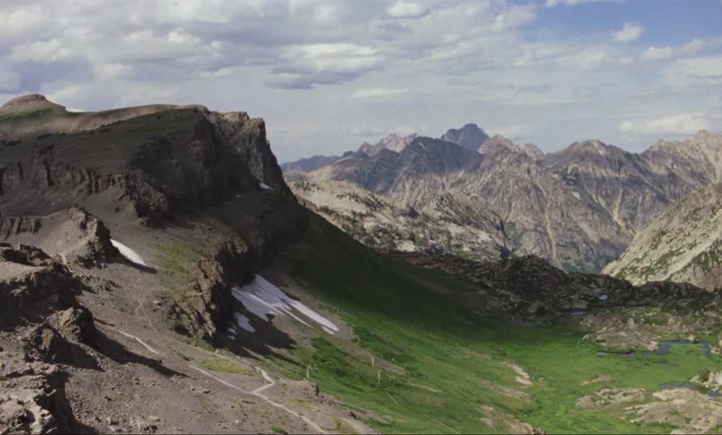 Vintage still landscape of rugged rocky mountain range and deep valley