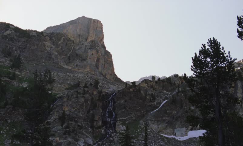Water creates lines on a rocky ridge as it flows down