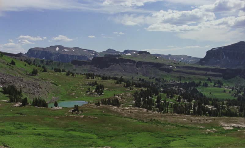 The pond sits at the bottom of the hills