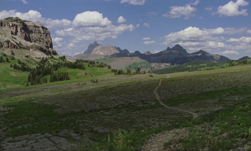 A countryside dotted with mountains in the spring