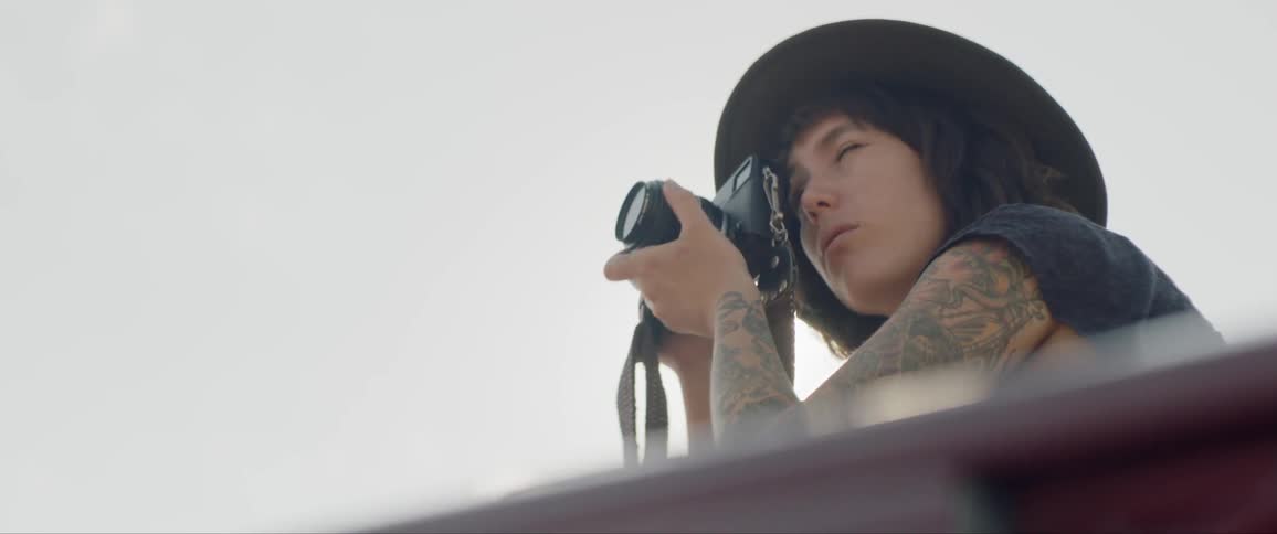 Photographer shoots pictures under bright sun