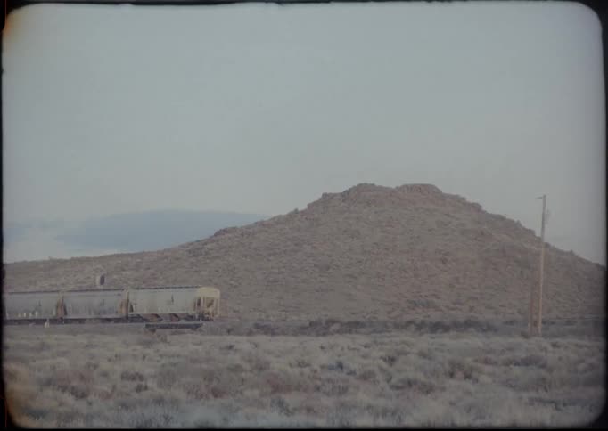 A train travels through rural countryside
