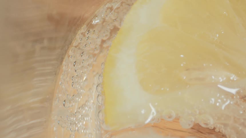 Bubbles pop next to a gelled substance