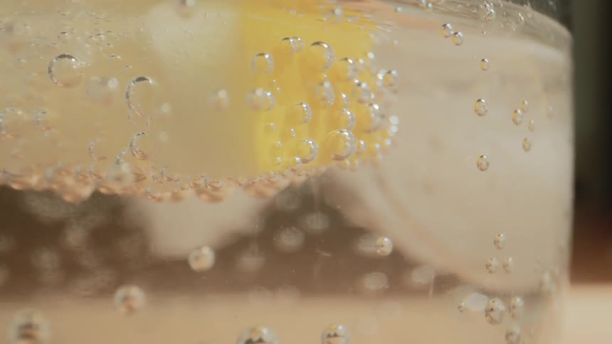 Bubbles rising up in a glass