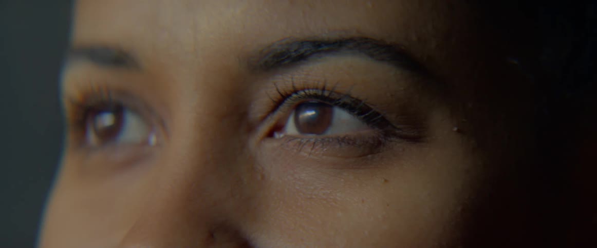 A woman is blinking and taking a photograph
