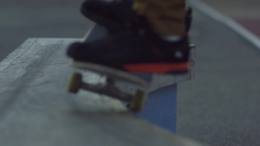A skateboarder grinding the top edge of a bench