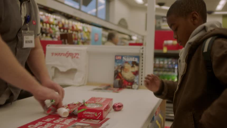 A person puts items on the counter to purchase