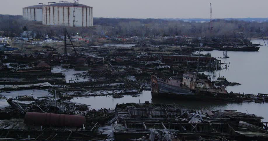 An aerial view of abandoned ships in a shipyard