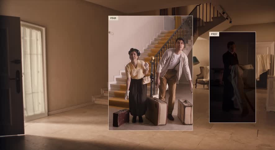 People walk into a home carrying suit cases