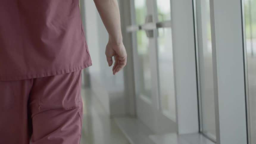 Doctor walks down the hospital corridor
