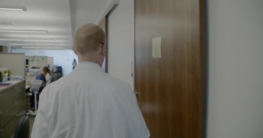 A man walks to the room in the hospital office