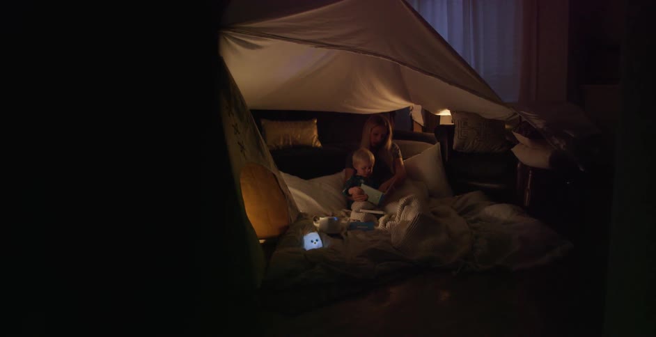 A tent is set up in a bedroom