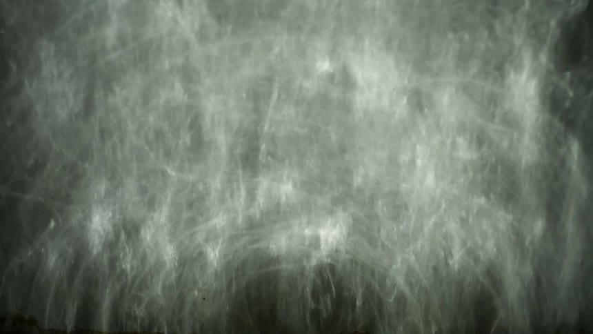 White light flashes against a dark surface