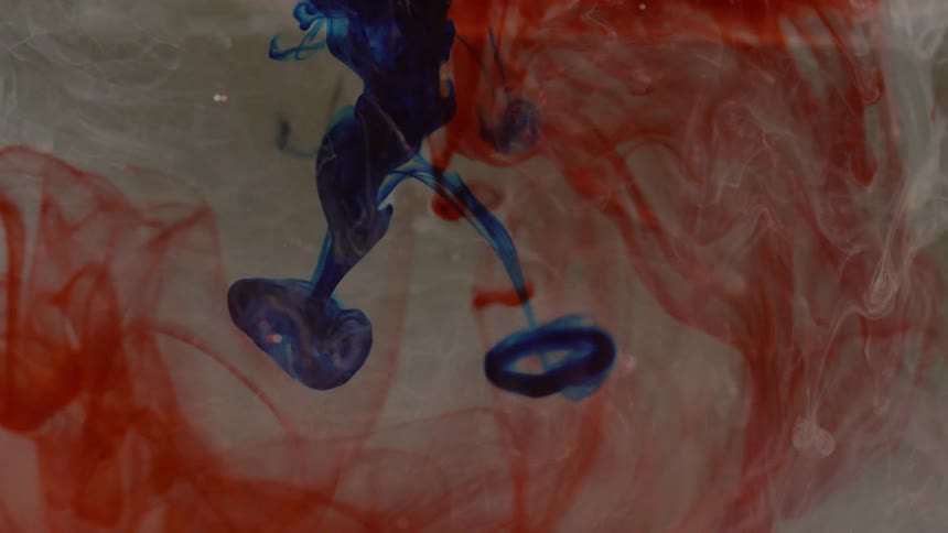 Colors flow swirl and blend in liquid medium