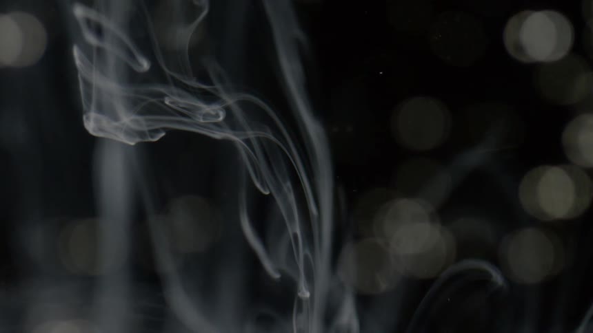White swirls are suspended in liquid
