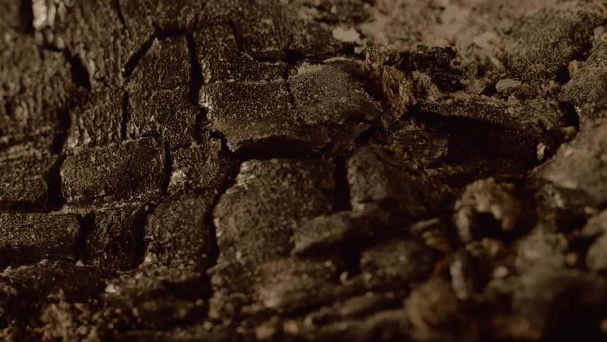Close up view of debris blowing across rocks