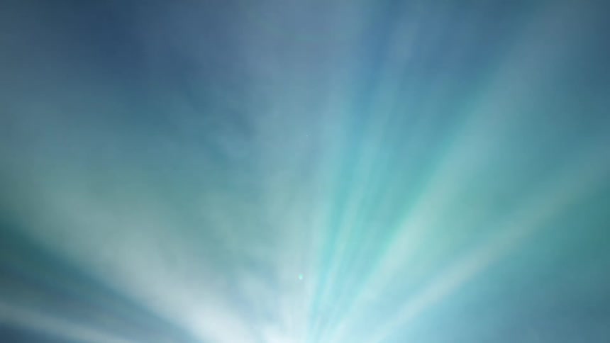 Abstract light beams cut through smoke