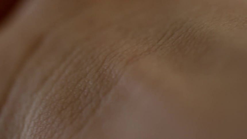 Extreme close up of muscles moving under human skin