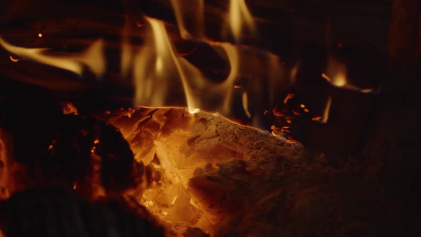A fire burns in a firepit