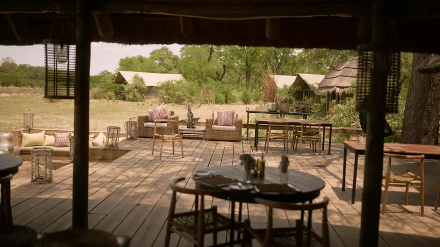 A sprawling deck wraps around a rural home