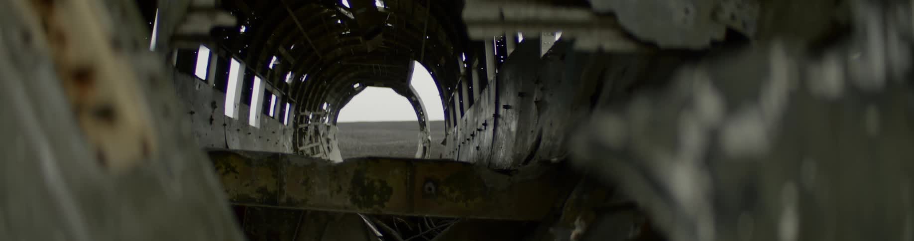 Circular opening sits at the end of a tunnel