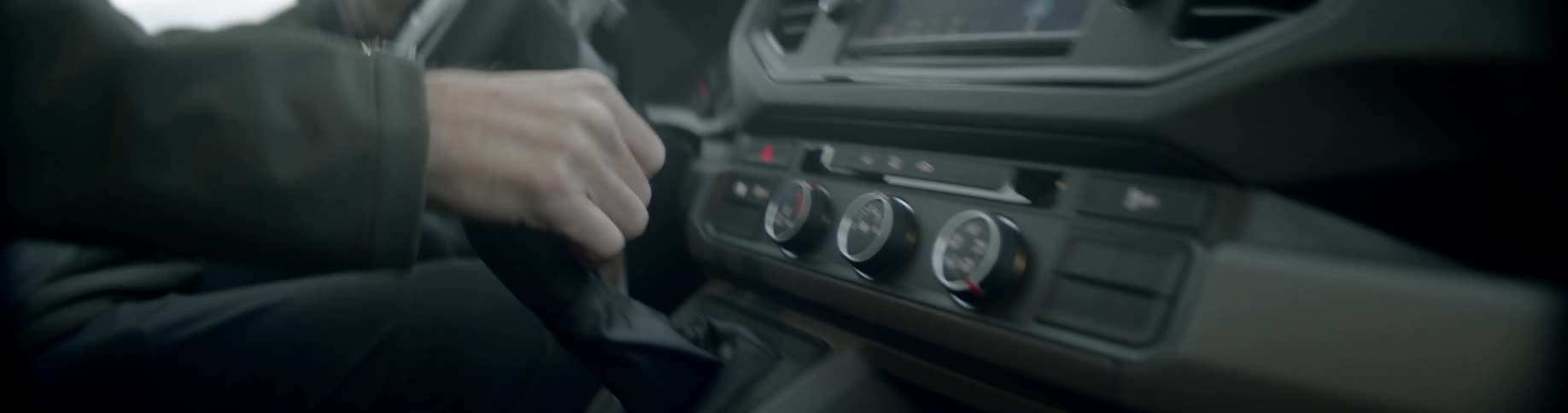 A man turns the volume in the car