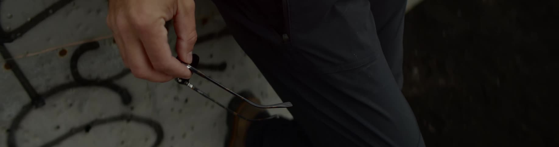 A man holds glasses