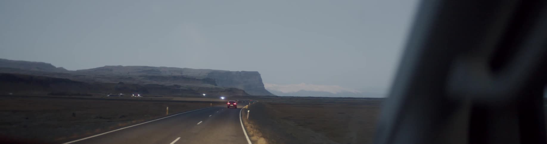 A person drives a long a street