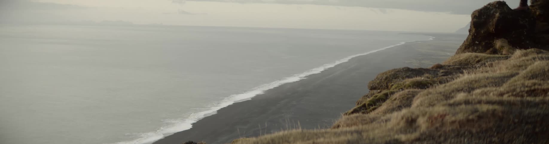 Cliffs overlook a beach and ocean