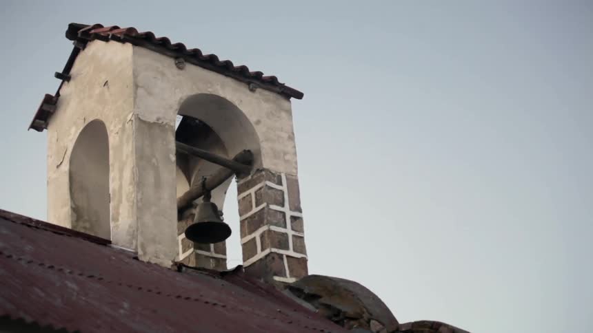 A church bell on a roof