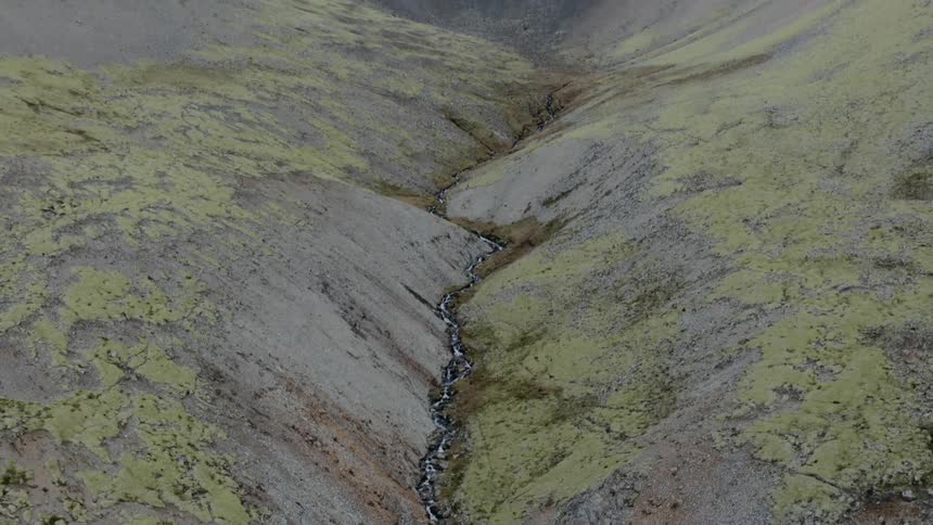 A river running through a steep gorge of a mountain