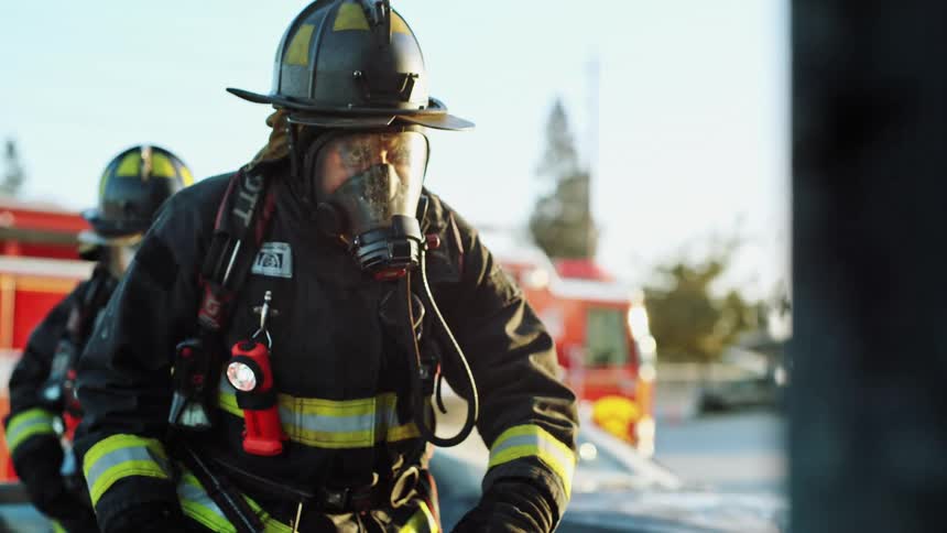 Firefighters walking in slow motion