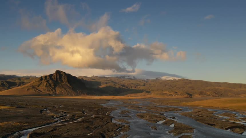 Time lapse view of clouds over hills
