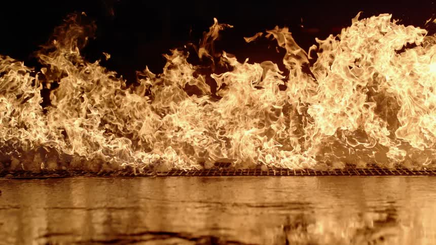 A large fire travel across the land