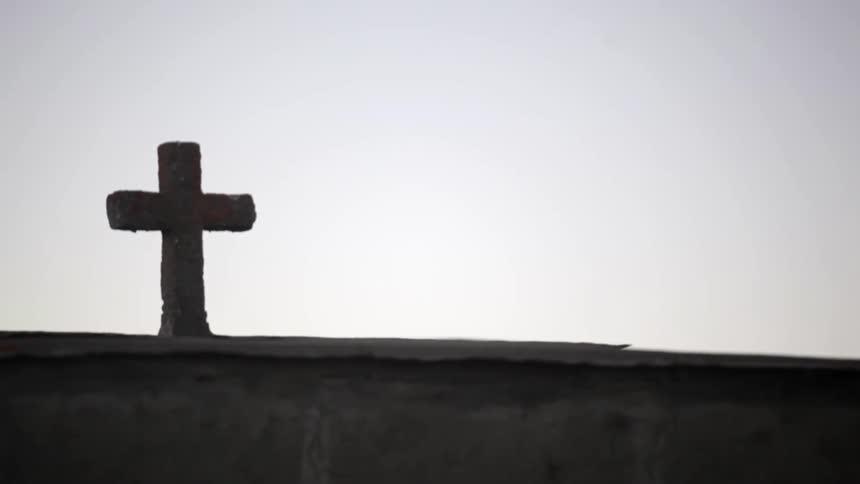 Cross against a grey sky