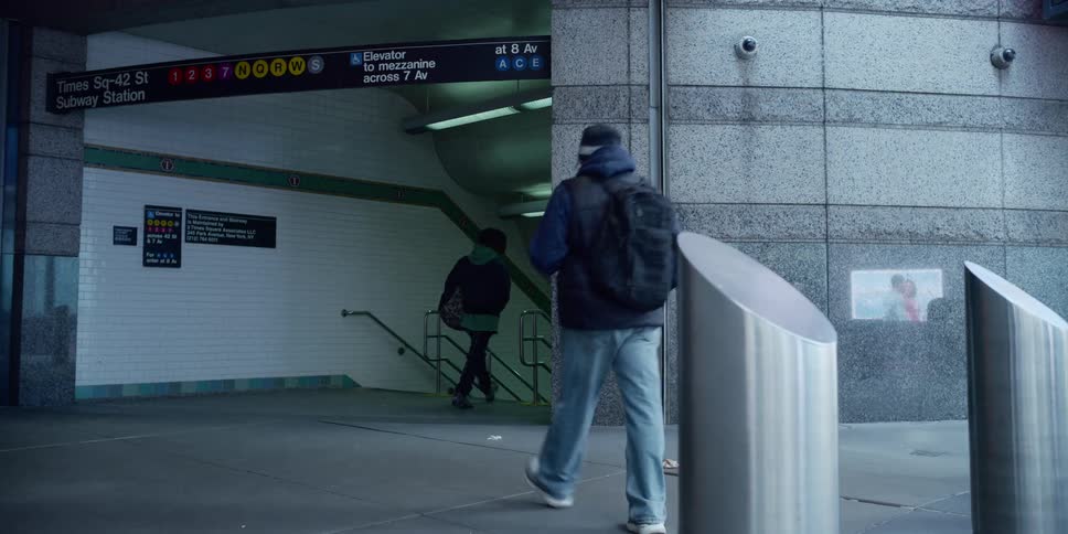 Pedestrians entering new york subway on times square 42nd street