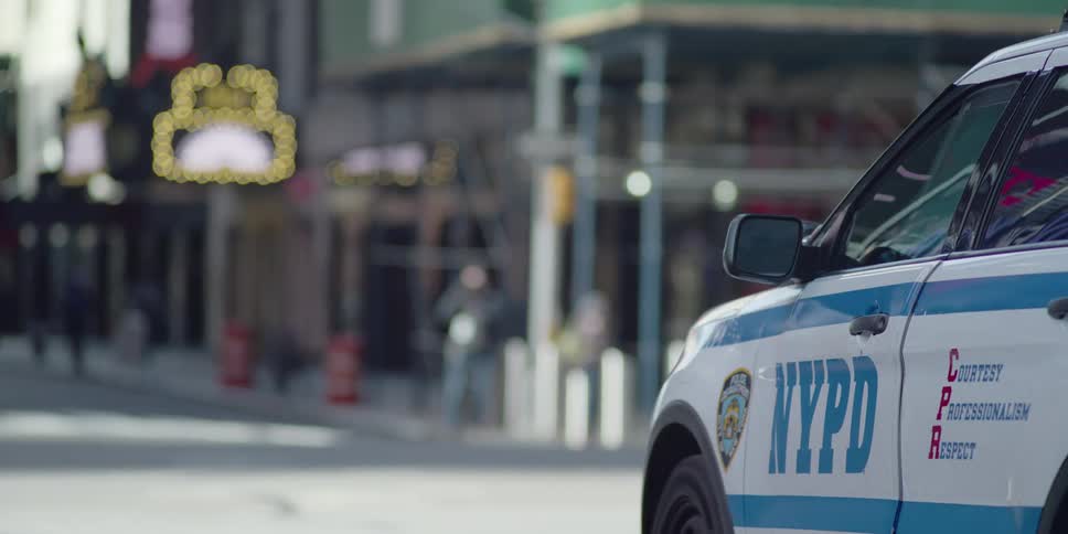 New york police department patrol car parked on downtown street