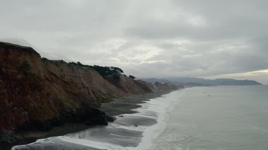 Waves roll in to the shoreline