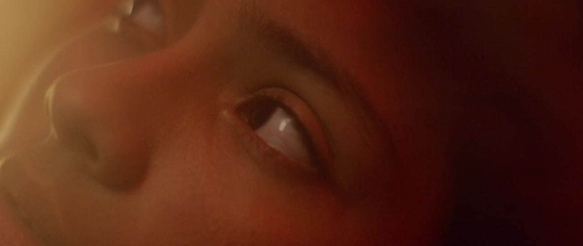 A woman twitches before she wakes up and opens her eyes looking around