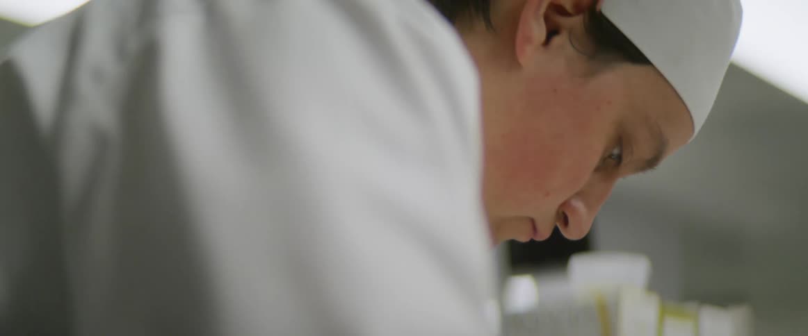 A chef is working in the kitchen