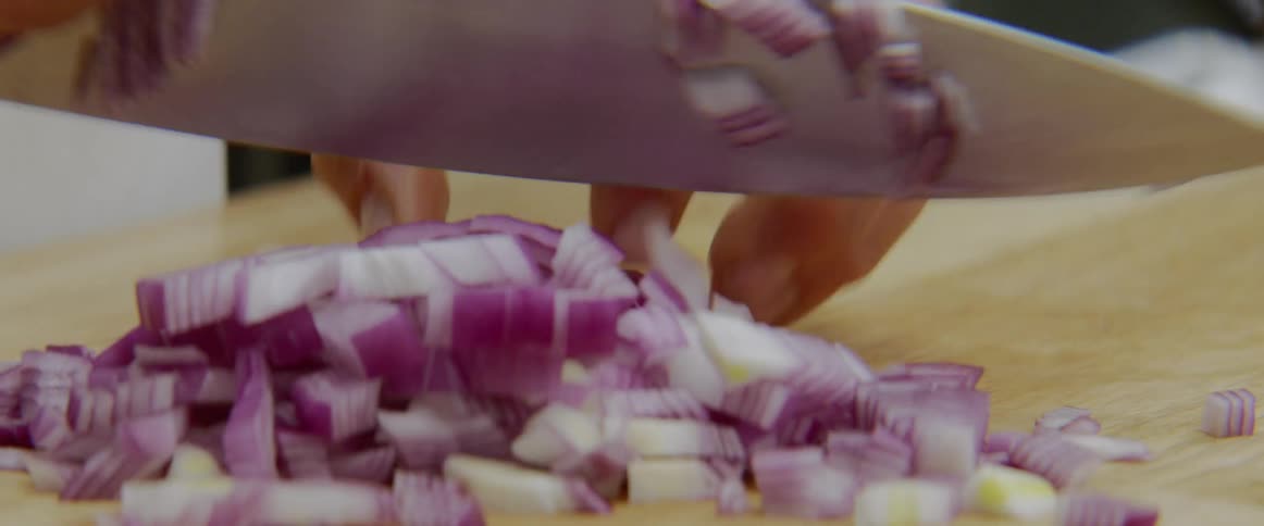 A man cuts an onion