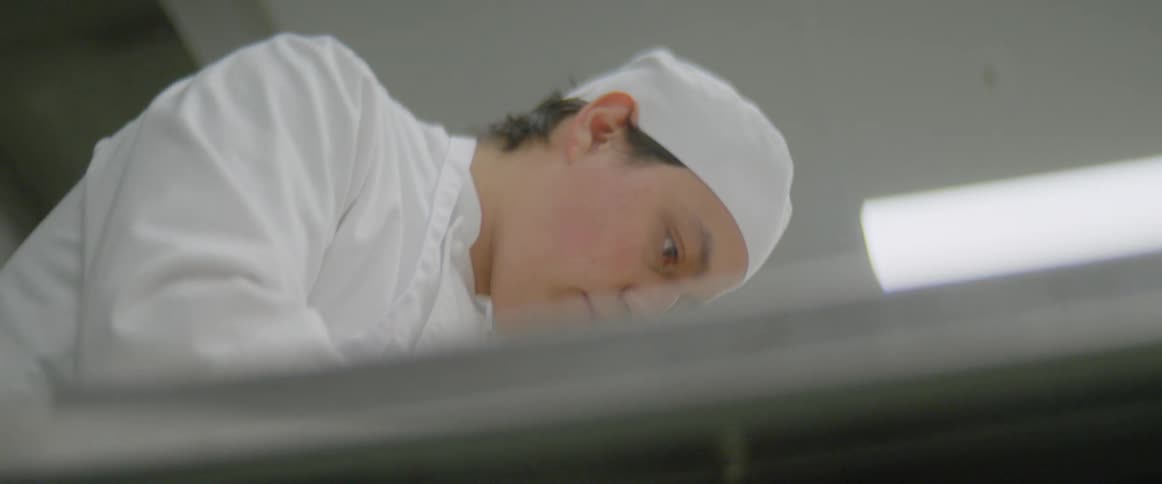 A chef works to prepare food